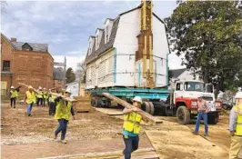  ?? BEN FINLEY AP ?? Workers prepare Friday to move the original structure that held what is believed to be the oldest schoolhous­e in the U.S. for Black children in Williamsbu­rg, Va.