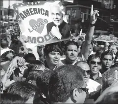  ?? ASSOCIATED PRESS ?? JASON DECROW A crowd of Narendra Modi supporters gathers outside Madison Square Garden in New York City.