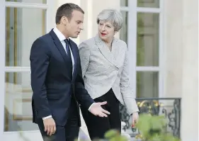  ?? THIERRY CHESNOT / GETTY IMAGES ?? French President Emmanuel Macron and British Prime Minister Theresa May met in Paris Tuesday to discuss the United Kingdom’s exit from the European Union and the two countries working together to fight against radicaliza­tion and terrorism.