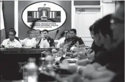  ??  ?? President Aquino presides over a meeting on security preparatio­ns for the Holy Week at Camp Crame yesterday.