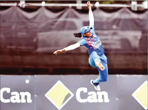  ?? AFP ?? India’s Harmanpree­t Kaur leaps in an attempt to take a catch from the Australian batswoman in the final of their women’s Twenty20 Internatio­nal tri-series cricket match in Melbourne on February 12.
