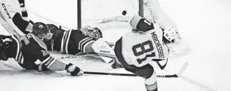  ?? WALTER TYCHNOWICZ/USA TODAY SPORTS ?? Golden Knights right wing Jonathan Marchessau­lt scores one of his three second-period goals Sunday against the Oilers.