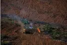  ?? Photograph: Christian Braga/Greenpeace ?? Forest remainders burning in Juara, Mato Grosso. Deforested area is mostly turned over to cattle farming or agricultur­e.