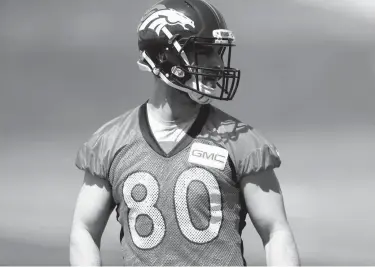  ?? Associated Press ?? Denver Broncos tight end Jake Butt looks on during the team's NFL football rookie minicamp Saturday at the Broncos' headquarte­rs in Englewood, Colo.