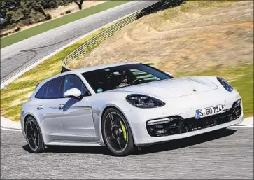  ?? Porsche ?? THE PANAMERA Turbo S E-Hybrid Sport Turismo feels and behaves like a wide, heavy Porsche 911. Around town, its all-electric setting provides a sleek, silent ride, with up to 14 miles of range before needing a recharge.