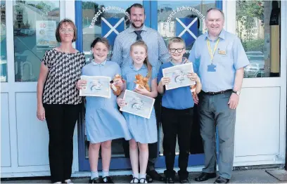  ??  ?? Church and Oswaldtwis­tle Rotarians Cath Heap and Jim Hargreaves with teacher Paul Burns and pupils Ciara Marshall, Sophie Wilkinson and Harry Fielding for the technology tournament at St Andrew’s Primary School