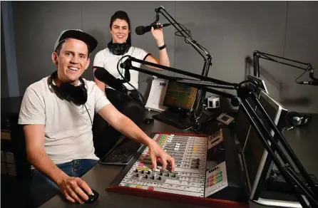  ?? PHOTO: BIANCA DE MARCHI ?? CAREER CHANGE: Damon Adams, pictured with his co-host Kristel Dally in their studio, left a teaching career for radio.