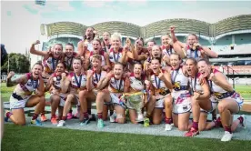  ?? Photograph: Matt Turner/AAP ?? Brisbane Lions players celebrate their victory in the 2021 AFLW grand final.