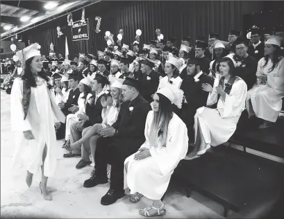  ?? Photo by Ernest A. Brown ?? Senior Class President Jillian Cash is applauded as she takes the stage for her Commenceme­nt Address during the school's 116th Commenceme­nt Friday evening.