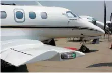  ??  ?? (Top) IndiGo at the launch of the first A320neo powered by PurePower engine by Pratt & Whitney; (above) Embraer Phenom 100E.