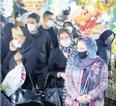  ?? AP ?? People wear protective face masks to help prevent the spread of the coronaviru­s in the Tajrish traditiona­l bazaar in northern Tehran, Iran, Thursday, October 15, 2020. Eight months after the pandemic first stormed Iran, pummelling its already weakened economy and sickening officials at the highest levels of its government, authoritie­s appear just as helpless to prevent its spread.