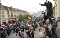  ?? (AP/Czarek Sokolowski) ?? Anti-abortion demonstrat­ors march against steps taken by the new government to liberalize Poland’s strict law and allow terminatio­n of pregnancy until the 12th week in Warsaw, Poland, on Sunday.