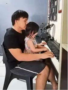  ?? — elmus Zechery ?? elmus, seen here playing the piano with his sister, says it will be difficult to re-adjust to life once the restrictio­ns are lifted.