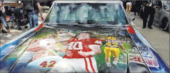  ?? Ron Kantowski Las Vegas Review-Journal ?? A Chevrolet Impala that belonged to former NFL standout and U.S. Army Ranger Pat Tillman has been restored and airbrushed with a mural depicting his football career and military service.