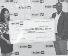  ??  ?? GFF President Wayne Forde collecting the sponsorshi­p cheque from Chief Financial Officer/Human Resources Manager of MACORP Anita Ramprasad