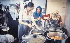  ?? GETTY IMAGES ?? Meghan Markle, Duchess of Sussex, with women at the Al Manaar Muslim Cultural Heritage Centre’s Hubb Community Kitchen in West London.