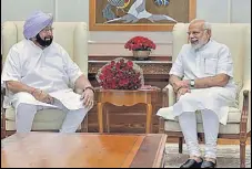  ?? PTI ?? Prime Minister Narendra Modi with Punjab chief minister Captain Amarinder Singh in New Delhi on Monday.