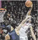  ?? DON PETERSEN / ASSOCIATED PRESS ?? Virginia Tech guard Justin Bibbs, who scored 18 points, goes for a dunk against Duke’s Jayson Tatum. The Hokies earned their eighth straight win.