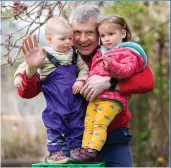  ?? Picture: Duncan Mcglynn ?? Willie Rennie with 17-month-old Cora Wilson, left, and Daphne Bell, 22 months, at Forbes Nursery in Edinburgh as he reveals childcare policies
