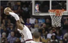  ?? CHUCK BURTON — ASSOCIATED PRESS ?? LeBron James dunks against the Hornets on March 28 Charlotte, N.C.