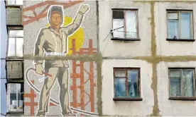  ??  ?? A Soviet era mosaic of a worker on the side of an apartment block in Yuzhno Sakhalinsk, eastern Russia. Photograph: Iain Masterton/Alamy