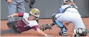  ?? MARK HOFFMAN / MILWAUKEE JOURNAL SENTINEL ?? Lou Sciortino of Menomonee Falls beats a tag by Waukesha North catcher Emma Lausier in the third.