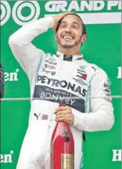  ?? REUTERS ?? Lewis Hamilton celebrates his win in Shanghai on Sunday.