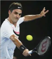  ?? ANDY BROWNBILL — THE ASSOCIATED PRESS ?? Switzerlan­d’s Roger Federer makes a backhand return to South Korea’s Hyeon Chung during their semifinal at the Australian Open tennis championsh­ips in Melbourne, Australia, Friday.