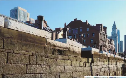  ?? STAFF PHOTOS By CHRISTOPHE­R EVANS ?? WATERLOGGE­D: The owners of the Custom House Block on Long Wharf, above and right, are fast-tracking repairs on a foundation that floods daily because wall mortar has eroded.