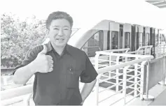  ??  ?? Lim giving the thumbs up for Melaka Monorail’s service yesterday. He believes it will be a key tourist attraction and expects to attract at least two million passengers a year once all upgrading jobs, which cost RM109 million, were completed within...