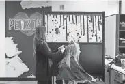  ?? ?? Senior director hair artist Miley cuts Kaitlin Wiora’s hair at the New Albany/gahanna Salon and Spa on Tuesday.