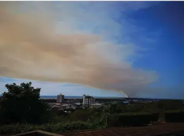  ??  ?? Photo taken from Canada Hill shows the thick smoke blanketing most parts of the city.