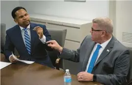  ?? E. JASON WAMBSGANS/CHICAGO TRIBUNE ?? Republican candidates for Illinois governor Richard Irvin, left, and Darren Bailey debate before the Chicago Tribune Editorial Board on May 17.