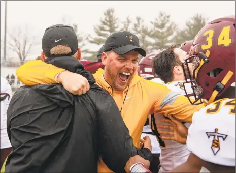  ?? David G. Whitham / For Hearst Connecticu­t Media ?? Sheehan coach John Ferrazzi celebrates as the final seconds expire against Bloomfield in the Class S state final in 2019.