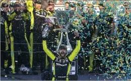  ?? DARRYL WEBB — THE ASSOCIATED PRESS ?? Ryan Blaney, driver of the No. 12 Menards Ford, celebrates after winning the NASCAR Cup championsh­ip after a second-place finish in Sunday's race at Phoenix Raceway.