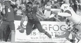  ?? Defensive starters lost: SAN DIEGO UNION-TRIBUNE ?? San Diego State running back Juwan Washington scores a touchdown against Hawaii during the 2018 season. Washington is one of the Aztecs’ top returning players.