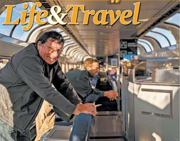  ??  ?? Teddy Christjohn, 71, of Wisconsin, and James Lotterer, 31, of New York, met in the Southwest Chief’s observatio­n car, where they took in the view of Colorado.