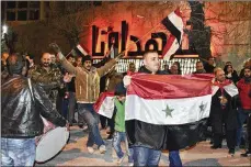  ?? SANA VIA AP ?? Syrians celebrate in Aleppo province, Syria. On Monday, Syria’s military announced it has regained control of territorie­s in northweste­rn Syria.