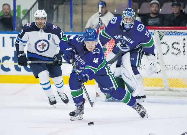  ?? — BOB FRID ?? Canucks defence prospect Olli Juolevi clears the puck out of harm’s way with an outlet pass during Friday game against Winnipeg at the Young Stars Classic in Penticton. After a year in the Finnish league, the No. 5 overall draft pick says he’s ready to start his NHL career.