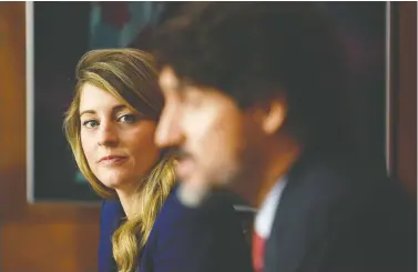  ?? ADRIAN WYLD/THE CANADIAN PRESS ?? The official languages paper Economic Developmen­t and Official Languages Minister Mélanie Joly presented last week had “something for everyone,” Tom Mulcair says. He thinks the PM, shown with Joly last fall, is planning an election.