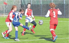  ??  ?? This Blairgowri­e & Rattray player shoots for goal against Monifieth. The game, played in Carnoustie, ended 5-5.