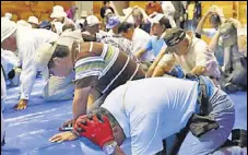  ?? REUTERS ?? Locals in Japan’s Takikawa take part in an emergency drill.