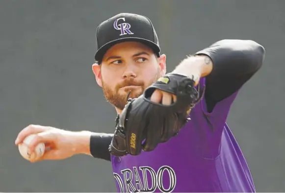  ?? Morry Gash, The Associated Press ?? Rockies reliever Adam Ottavino throws during a spring training workout in Scottsdale, Ariz., in February.