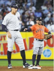  ?? Michael Ciaglo / Houston Chronicle ?? New York’s Aaron Judge (left) stands on second, a foot taller than fellow MVP candidate Jose Altuve.