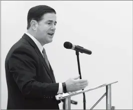  ?? Buy this photo at YumaSun.com PHOTO BY RANDY HOEFT/YUMA SUN ?? ARIZONA GOV. DOUG DUCEY DELIVERS HIS STATE OF THE STATE address last week inside the Schoening Conference Center on the Arizona Western College main campus. Ducey has warned that he would oppose any attempts to repeal a new $32-per-vehicle registrati­on fee in Arizona that would collect $185 million a year.