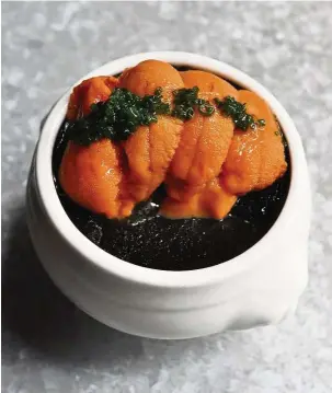  ??  ?? A Lolla signature – the unctuous, unexpected squid ink and sea urchin pudding.