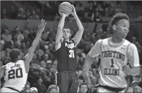  ?? Associated Press ?? Taking aim: In this Feb. 22, 2018, file photo, Purdue guard Dakota Mathias (31) shoots against Illinois guard Da'Monte Williams (20) during the second half of a game in Champaign, Ill. Mathias has developed a real affinity for old-school basketball....