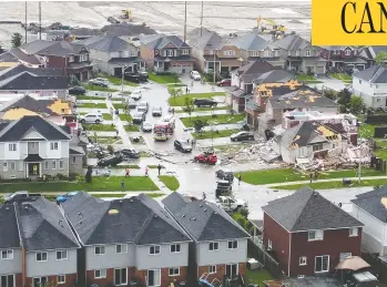  ?? COURTESY OF EDWARD LOVELESS / SOCIAL MEDIA VIA REUTERS ?? An aerial view shows damage to buildings in a suburb of Barrie, Ont., in the aftermath of Thursday's tornado. Residents returned on Friday to fetch pets and valued possession­s as Ontario Premier Doug Ford toured the area.