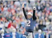  ?? [CHARLES KRUPA/THE ASSOCIATED PRESS] ?? New England Patriots quarterbac­k Tom Brady celebrates a touchdown by running back Dion Lewis during the second half against the Buffalo Bills, Dec. 24 in Foxborough, Mass.