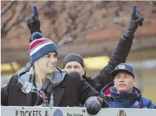  ?? STAFF PHOTO BY MARK GARFINKEL ?? THAT WAS THEN: Jimmy Garoppolo, Tom Brady and Brady’s personal trainer Alex Guerrero ride in the Pats Super Bowl parade in February.